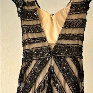 Long formal cap sleeve with V-back black sequin pattern fitted dress